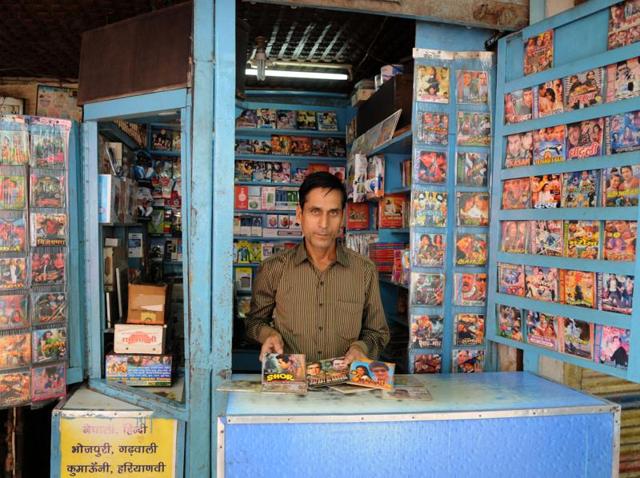 Invasion of smartphones, pen drives, and portable media players is something which is bowing down 48-year-old Rajender Gupta (above) who runs a 5x5 shop in a lane behind Gurgaon bus stand. (Parveen Kumar/HT Photo) Invasion of smartphones, pen drives, and portable media players is something which is bowing down 48-year-old Rajender Gupta (above) who runs a 5x5 shop in a lane behind Gurgaon bus stand. (Parveen Kumar/HT Photo)