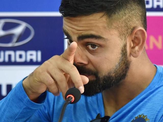 India's captain Virat Kohli carries a trash bin during a practice session in Kanpur on Wednesday. (AP) India's captain Virat Kohli carries a trash bin during a practice session in Kanpur on Wednesday. (AP)