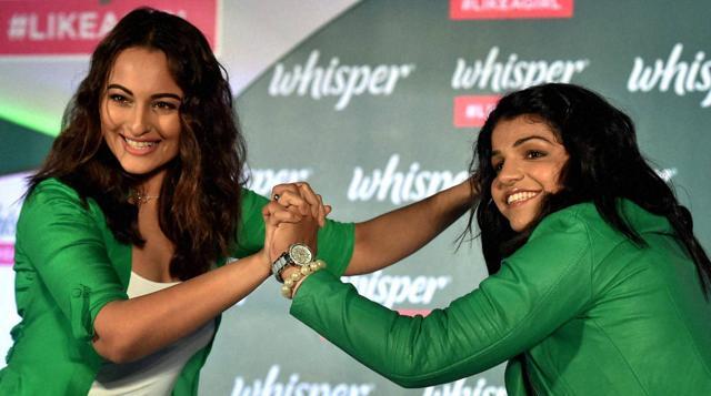 Sakshi Malik and bollywood actress Sonakshi Sinha during a promotional event in Mumbai on Tuesday. (PTI)