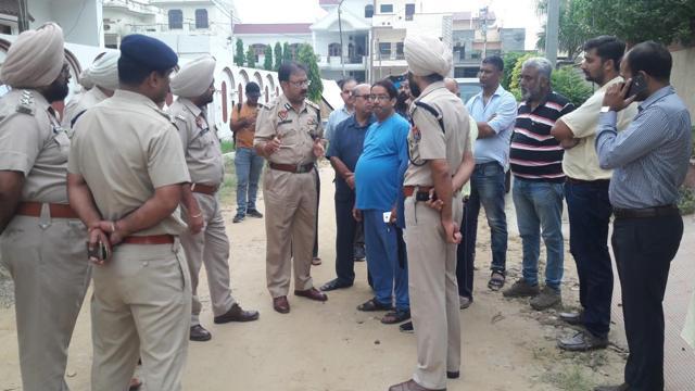 Commissioner of police Arpit Shukla meets police officials outside Gagneja’s residence in Jalandhar Cantt. (Pardeep Pandit/HT Photo) Commissioner of police Arpit Shukla meets police officials outside Gagneja’s residence in Jalandhar Cantt. (Pardeep Pandit/HT Photo)