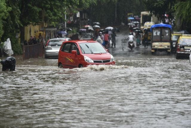 A car tries to drive through a submerged street in Wadala on Thursday. (Kunal Patil/HT Photo) A car tries to drive through a submerged street in Wadala on Thursday. (Kunal Patil/HT Photo)