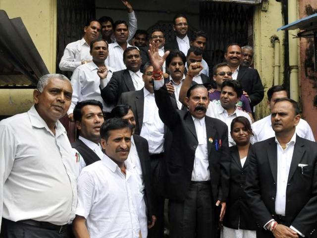 Members of Indore district bar association stage a protest demanding enactment of lawyers’ protection act on Wednesday.(Arun Mondhe/HT photo)