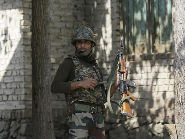 An Indian army soldier stands at his post in Braripora, near the de facto border dividing Kashmir between India and Pakistan. Thursday’s encounter comes three days after militants believed to be from Pakistan attacked an army camp in Uri.(AP) An Indian army soldier stands at his post in Braripora, near the de facto border dividing Kashmir between India and Pakistan. Thursday’s encounter comes three days after militants believed to be from Pakistan attacked an army camp in Uri.(AP)