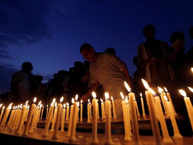 A man lights a candle during a vigil for the soldiers who were killed after gunmen attacked an Indian army base in Kashmir's Uri on Sunday, in Ahmedabad. (REUTERS) A man lights a candle during a vigil for the soldiers who were killed after gunmen attacked an Indian army base in Kashmir's Uri on Sunday, in Ahmedabad. (REUTERS)