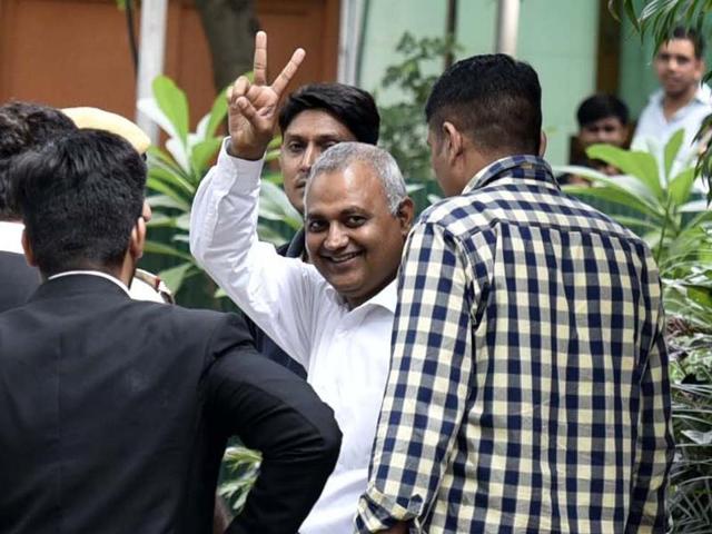 AAP’s Somnath Bharti shows the victory sign after being arrested, at the Hauz Khas police station in New Delhi on Thursday. (Arun Sharma/HT Photo) AAP’s Somnath Bharti shows the victory sign after being arrested, at the Hauz Khas police station in New Delhi on Thursday. (Arun Sharma/HT Photo)