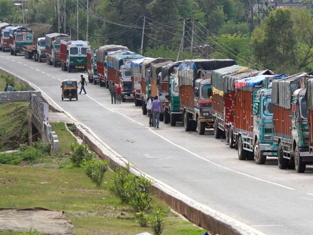 Stranded trucks wait for the Jammu-Srinagar highway to reopen on the outskirts of Jammu. Works on several road projects along the India-China border have been stalled due to several logistics, including the Kashmir violence. (AP File) Stranded trucks wait for the Jammu-Srinagar highway to reopen on the outskirts of Jammu. Works on several road projects along the India-China border have been stalled due to several logistics, including the Kashmir violence. (AP File)