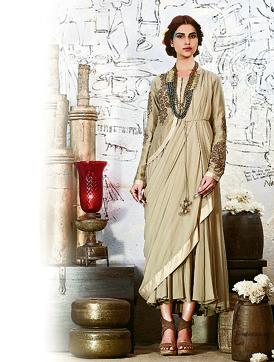 Experiment with dhoti saris teamed with anti-fit blouses or crop tops for a refreshing break from the regular six-yards. (Ekru ) Experiment with dhoti saris teamed with anti-fit blouses or crop tops for a refreshing break from the regular six-yards. (Ekru )