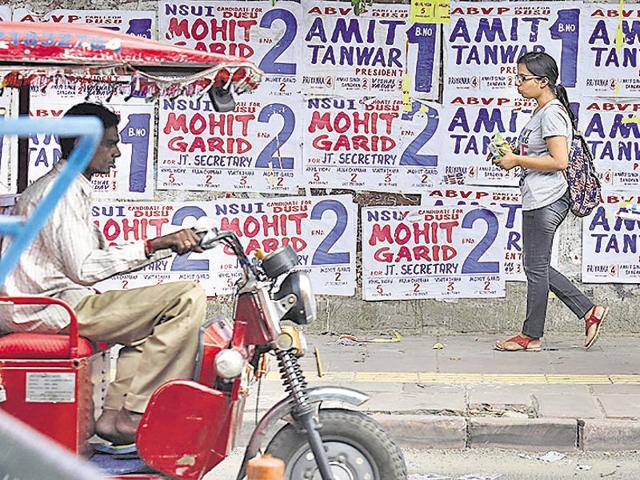 During DU elections, student organisations campaign by sticking posters on the university and college walls, and litter the street with papers. (Raj K Raj/Hindustan Times) During DU elections, student organisations campaign by sticking posters on the university and college walls, and litter the street with papers. (Raj K Raj/Hindustan Times)