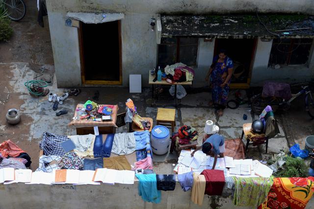 Residents dry out their belongings following heavy rains caused flooding in the low-lying area of Quthbullapur on the outskirts of Hyderabad. (AFP) Residents dry out their belongings following heavy rains caused flooding in the low-lying area of Quthbullapur on the outskirts of Hyderabad. (AFP)