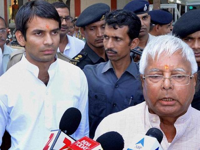 Rashtriya Janata Dal chief Lalu Prasad Yadav with is son Tej Pratap in May 2015. (PTI File) Rashtriya Janata Dal chief Lalu Prasad Yadav with is son Tej Pratap in May 2015. (PTI File)