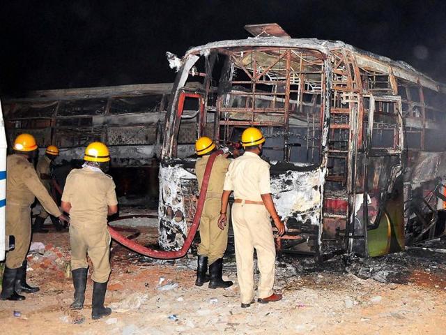 Tamil Nadu-bound buses were set on fire during a protest over the Cauvery water dispute, in Bengaluru. (PTI File Photo) Tamil Nadu-bound buses were set on fire during a protest over the Cauvery water dispute, in Bengaluru. (PTI File Photo)
