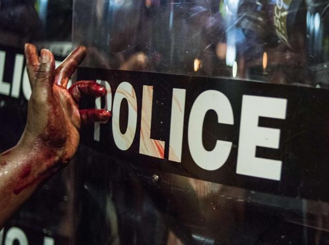 A demonstrator shouts during protests on September 21, 2016 in downtown Charlotte, North Carolina. The protests are the latest results in a series of black deaths at the hands on white police officers in the US. (AFP) A demonstrator shouts during protests on September 21, 2016 in downtown Charlotte, North Carolina. The protests are the latest results in a series of black deaths at the hands on white police officers in the US. (AFP)