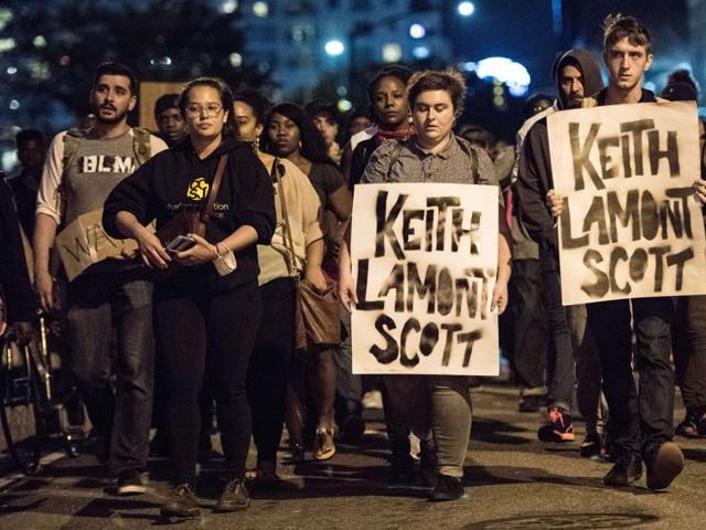 Demonstrators march during protests in Charlotte, North Carolina. Protests began on Tuesday night following the fatal shooting of 43-year-old Keith Lamont Scott at an apartment complex near UNC Charlotte. (AFP) Demonstrators march during protests in Charlotte, North Carolina. Protests began on Tuesday night following the fatal shooting of 43-year-old Keith Lamont Scott at an apartment complex near UNC Charlotte. (AFP)
