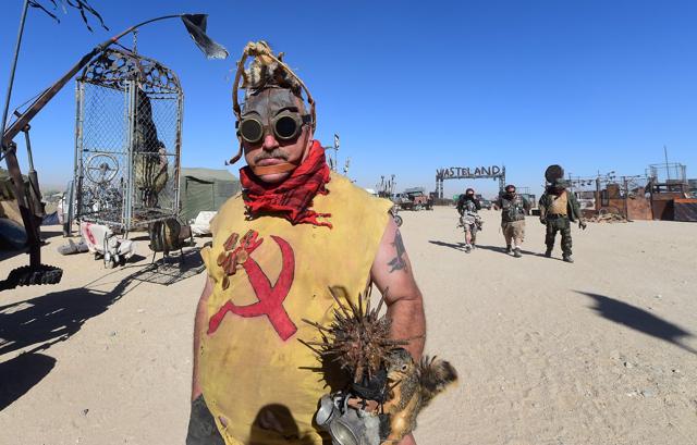 Festival goers, including Joseph Hileman (L) attend the first day of Wasteland Weekend in the high desert community of California City in the Mojave Desert. (AFP)