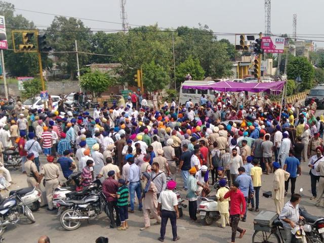 A protest over sacrilege of holy book in Jalandhar on Saturday. (HT Photo) A protest over sacrilege of holy book in Jalandhar on Saturday. (HT Photo)