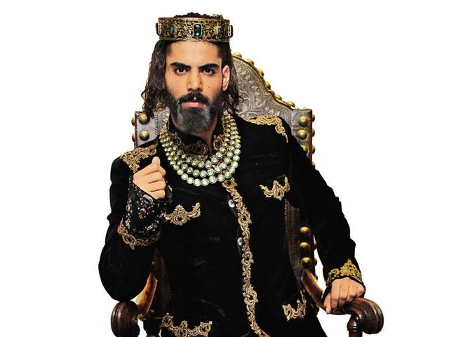 Easy lies the head that wears the crown: Model Arya Bhat sports a wedding ensemble for men by Rohit Bal. (Photo: Shivam Saxena)