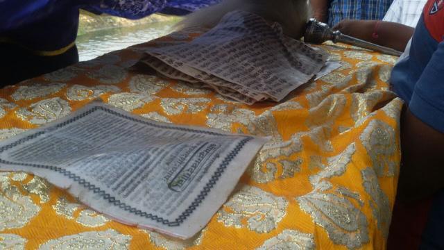 Torn pages of the Bhagvad Gita recovered from the canal in Jalandhar on Saturday. (Sikander Singh Chopra/HT Photo)