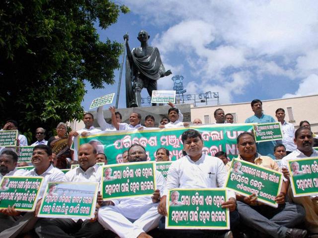 Biju Janata Dal MLAs sit on dharana on Mahanadi water issue near Mahatma Gandhi statue in Assembly premises on the 2nd day of monsoon session in Bhubaneswar on Thursday. (PTI Photo) Biju Janata Dal MLAs sit on dharana on Mahanadi water issue near Mahatma Gandhi statue in Assembly premises on the 2nd day of monsoon session in Bhubaneswar on Thursday. (PTI Photo)