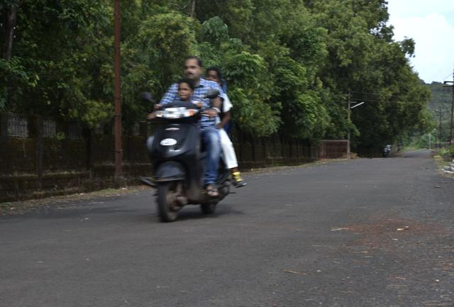 The Aroskars drive down one of the several roads in Vengurla that has been built from bitumen, a material derived from discarded plastic like wrappers and sachets. (Anshuman Poyrekar/HT PHOTO)