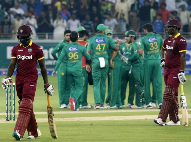 Pakistan's Imad Wasim (4th left) celebrates with teammates after bowling out West Indies' Andre Fletcher. (AFP) Pakistan's Imad Wasim (4th left) celebrates with teammates after bowling out West Indies' Andre Fletcher. (AFP)
