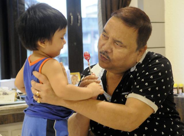 Madan Mitra with grandson in his hotel room. Maharoop is now his lifeline. (Ashok Nath Dey) Madan Mitra with grandson in his hotel room. Maharoop is now his lifeline. (Ashok Nath Dey)