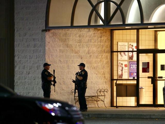 Law enforcement officers stand outside of Cascade Mall in Burlington, where several people were fatally shot on Friday, Sept 23, 2016. (AP) Law enforcement officers stand outside of Cascade Mall in Burlington, where several people were fatally shot on Friday, Sept 23, 2016. (AP)