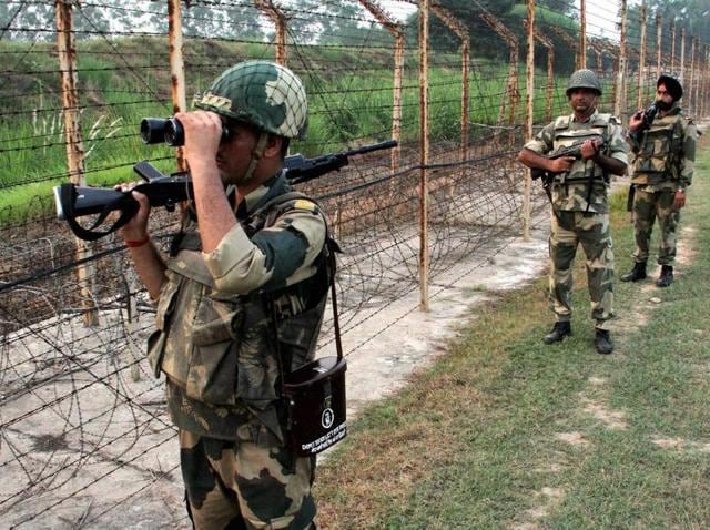 BSF personnel patrol along the India and Pakistan International Border at RS Pura, about 35 km from Jammu, on Saturday.(PTI) BSF personnel patrol along the India and Pakistan International Border at RS Pura, about 35 km from Jammu, on Saturday.(PTI)