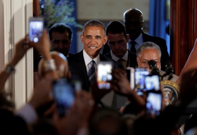 US President Barack Obama arrives for a reception marking the opening of the Smithsonian’s National Museum of African American History and Culture at the White House in Washington. US President Barack Obama arrives for a reception marking the opening of the Smithsonian’s National Museum of African American History and Culture at the White House in Washington.
