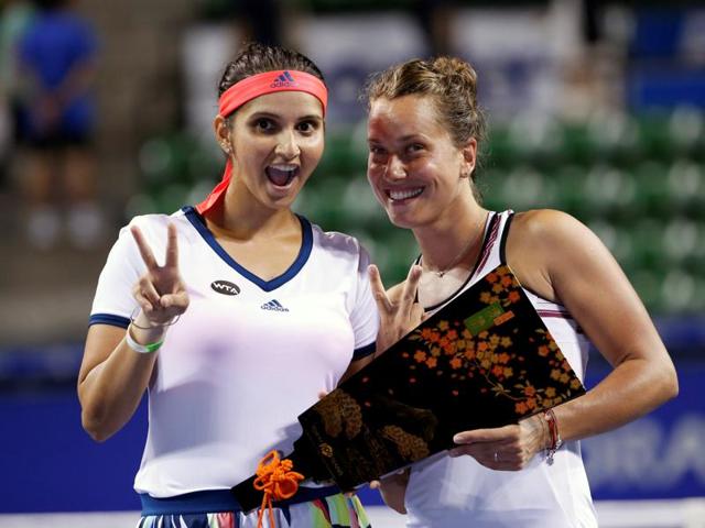 Sania Mirza of India (L) and Barbora Strycova of Czech Republic pose with their victory trophy on Septmber 24, 2016 after the Pan Pacific Open Women's Doubles Final match in Ariake Coliseum, Tokyo, Japan. (Kim Kyung-Hoon/REUTERS) Sania Mirza of India (L) and Barbora Strycova of Czech Republic pose with their victory trophy on Septmber 24, 2016 after the Pan Pacific Open Women's Doubles Final match in Ariake Coliseum, Tokyo, Japan. (Kim Kyung-Hoon/REUTERS)