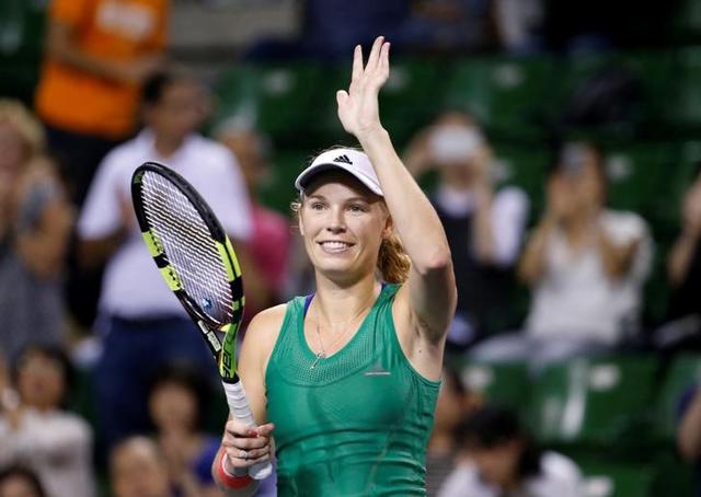 Caroline Wozniacki and Agnieszka Radwanska embrace at the net after the match.(AFP) Caroline Wozniacki and Agnieszka Radwanska embrace at the net after the match.(AFP)