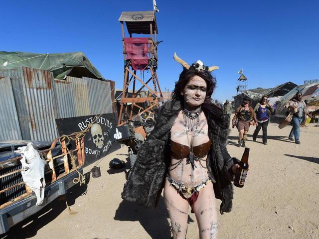 It isn’t just the facilities that dress down for the occasion. Attendees are required to fit in, which means a lot of torn leather, studs, grungy vests and goggles for protection from duststorms. (AFP) 