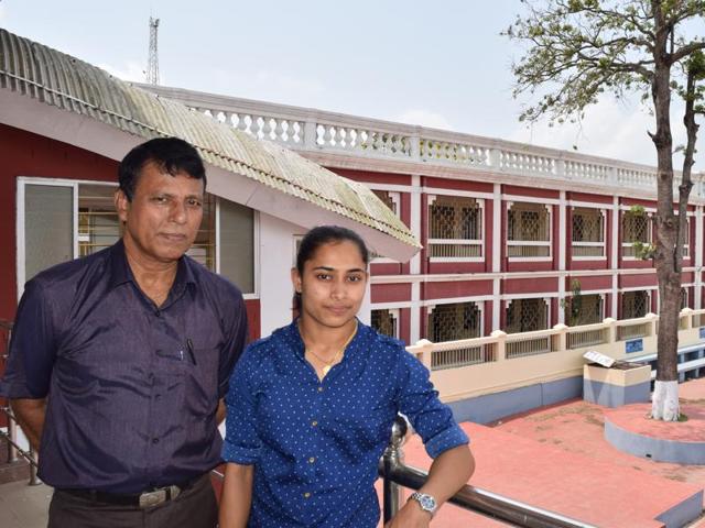 Dipa Karmakar and her coach Bishweshwar Nandi at a felicitation event in Kolkata.(Ashok Nath Dey/ HT Photo)