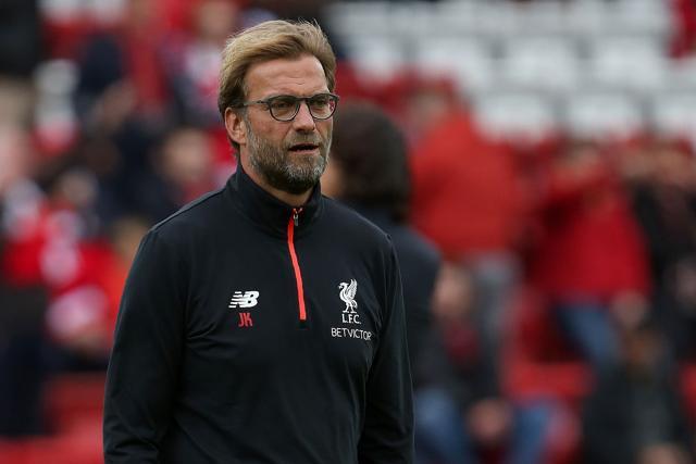 Liverpool's German manager Jurgen Klopp watches his players warm up ahead of the English Premier League football match between Liverpool and Hull City. (AFP Photo) Liverpool's German manager Jurgen Klopp watches his players warm up ahead of the English Premier League football match between Liverpool and Hull City. (AFP Photo)