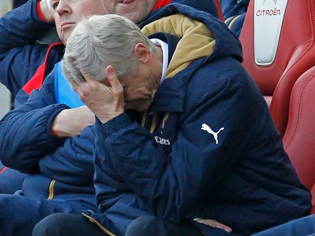 (Arsenal's French manager Arsene Wenger reacts in his seat as his team try to come back from two goals down in the FA Cup quarter final football match between Arsenal and Watford at the Emirates Stadium in London on March 13, 2016. (AFP File Photo)