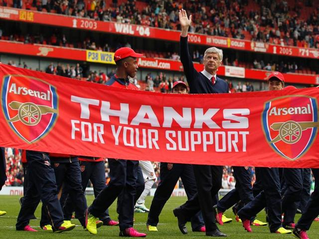 Wenger waves to the fans following the English Premier League football match between Arsenal and Aston Villa at the Emirates Stadium in London. (AFP File Photo)
