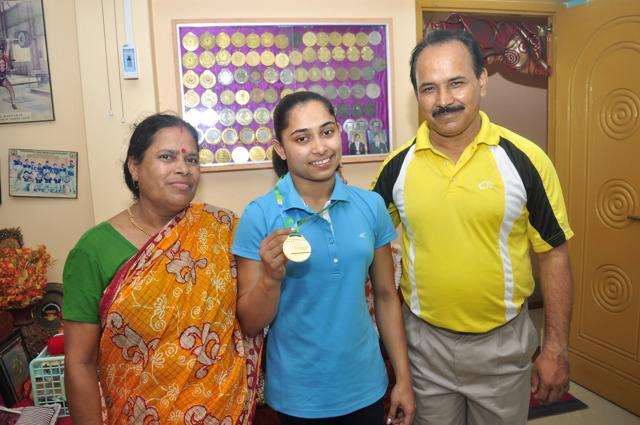 Dipa Karmakar with her parents at their home in Tripura. (HT Photo)