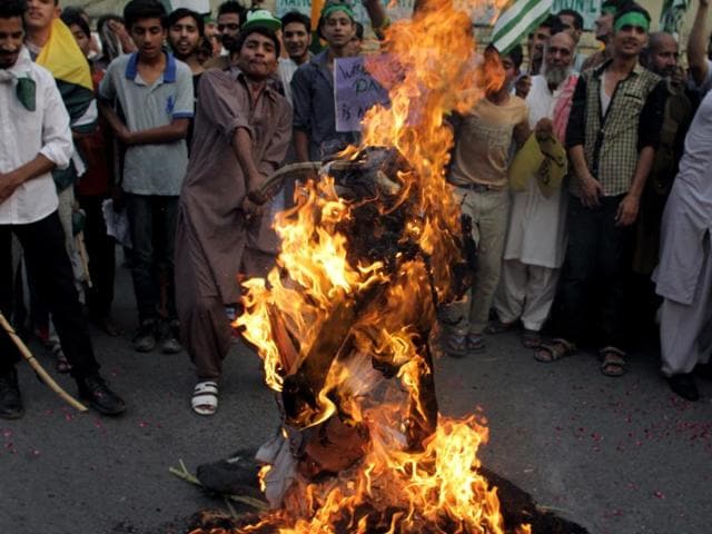 Supporters of the Pakistan Welfare Party burn an effigy of Prime Minister Narendra Modi during a demonstration in Lahore, Pakistan. (AP) Supporters of the Pakistan Welfare Party burn an effigy of Prime Minister Narendra Modi during a demonstration in Lahore, Pakistan. (AP)