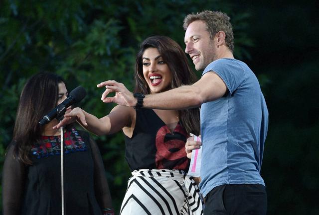 Actor Priyanka Chopra, left, and musician Chris Martin speak at the 2016 Global Citizen Festival in Central Park, New York. (AP) Actor Priyanka Chopra, left, and musician Chris Martin speak at the 2016 Global Citizen Festival in Central Park, New York. (AP)