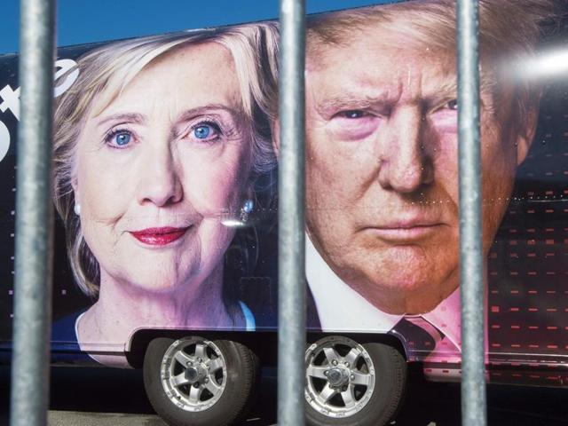 Stand-ins take to the lecturns for lighting and sound checks on Sunday at Hofstra University's David & Mack Sport and Exhibition Complex in Hempsted, New York ahead of the first head-to-head presidential debate between Republican nominee Donald Trump and Democratic nominee Hillary Clinton, to be held on Monday.(AFP)