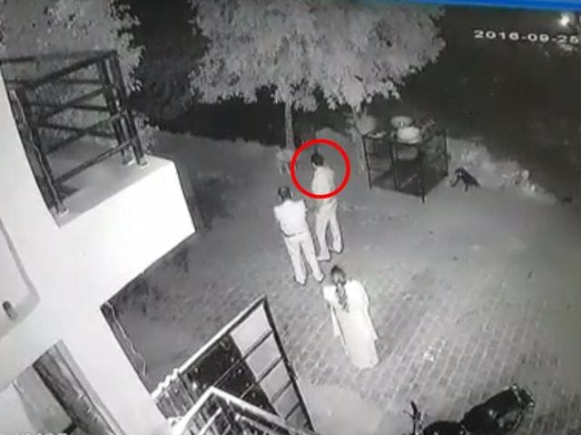The video shows sub-inspector whipping out his pistol and firing at the dog.(Screengrab)
