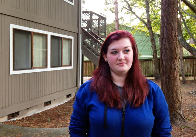 Amber Cathey, next-door nighbor and former high school classmate of Cascade Mall shooting suspect Arcan Cetin, stands in front of their building. As a neighbour, she said he was "creepy, rude and obnoxious" and was so frightened by him that she complained to apartment management and kept a Taser by her front door. (AP) Amber Cathey, next-door nighbor and former high school classmate of Cascade Mall shooting suspect Arcan Cetin, stands in front of their building. As a neighbour, she said he was "creepy, rude and obnoxious" and was so frightened by him that she complained to apartment management and kept a Taser by her front door. (AP)