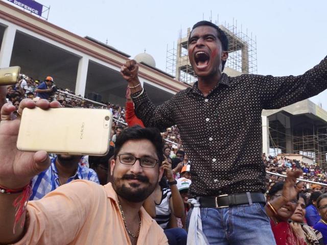 Spectators at the evening retreat ceremony on the Attari-Wagah border between India and Pakistan, near Amritsar, on September 19.(Sameer Sehgal/HT File Photo)