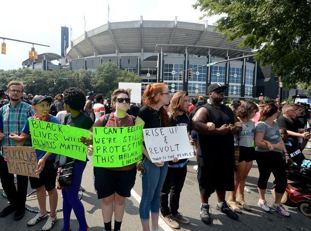 People protest outside Bank of America Stadium in Charlotte on Sunday (AP) People protest outside Bank of America Stadium in Charlotte on Sunday (AP)
