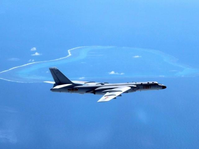 In this undated file photo released by Xinhua News Agency, a Chinese H-6K bomber patrols the islands and reefs in the South China Sea. (AP File Photo) In this undated file photo released by Xinhua News Agency, a Chinese H-6K bomber patrols the islands and reefs in the South China Sea. (AP File Photo)