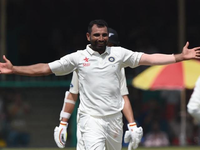 India's Mohammed Shami celebrates the wicket of New Zealand's Mark Craig. (AFP Photo)