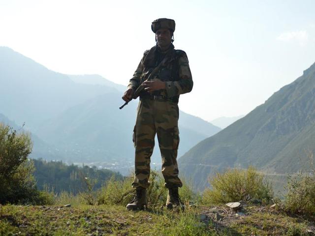 A soldier stands guard near the site of a gunbattle at an army base in Uri.(AFP File Photo) A soldier stands guard near the site of a gunbattle at an army base in Uri.(AFP File Photo)