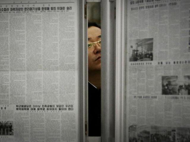 A North Korean man reads the local newspapers displayed in a subway station as seen during a press tour in Pyongyang, North Korea.(AP Photo) A North Korean man reads the local newspapers displayed in a subway station as seen during a press tour in Pyongyang, North Korea.(AP Photo)