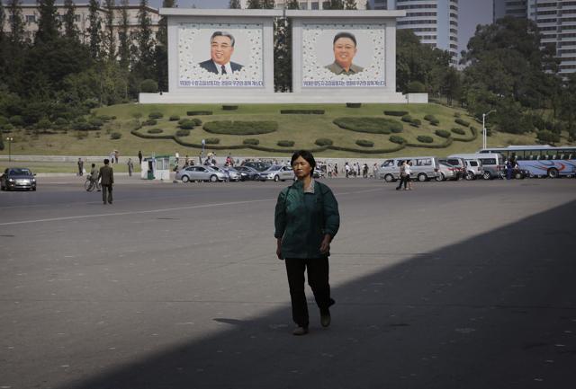 A North Korean woman walks down the street where murals of the late North Korean leaders Kim Il Sung, left, and Kim Jong Il decorate the streets in downtown Pyongyang, North Korea. (AP Photo) A North Korean woman walks down the street where murals of the late North Korean leaders Kim Il Sung, left, and Kim Jong Il decorate the streets in downtown Pyongyang, North Korea. (AP Photo)