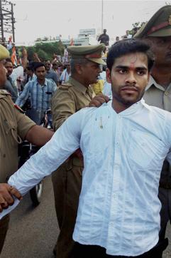 Police arrest Hari Om Misra, the youth who hurled a shoe at Congress Vice President Rahul Gandhi during his road show in Sitapur district of Uttar Pradesh. (PTI) Police arrest Hari Om Misra, the youth who hurled a shoe at Congress Vice President Rahul Gandhi during his road show in Sitapur district of Uttar Pradesh. (PTI)