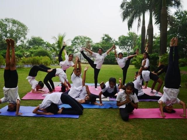 Students of Delhi Public School, Navi Mumbai, practise yoga.